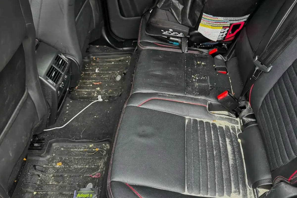 Dirty car seats and carpets before interior detailing in Berkeley, CA